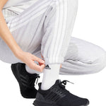 adidas Essentials 3-Stripes Fleece Loose-Fit Pants IN6178 - Sportmania.hu